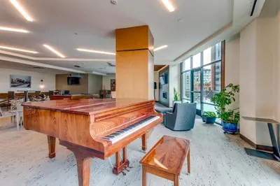 an office with a piano in a room at Downtown Denver Condo in the Center of the City! in Denver
