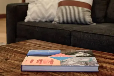 two books on a coffee table in front of a couch at Modern luxury mountain house in Fraser