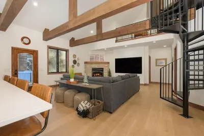 a living room with a couch and a fireplace at Luxury Mountain Retreat in Fraser