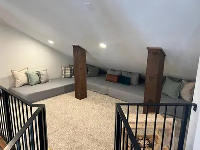 a attic room with two beds with pillows at Luxury Mountain Retreat in Fraser