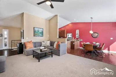 a living room with a couch and a table at Quiet Denver retreat w hot tub & fireplace in Denver