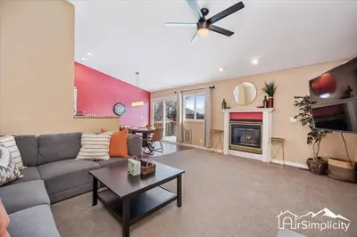 a living room with a couch and a fireplace at Quiet Denver retreat w hot tub & fireplace in Denver