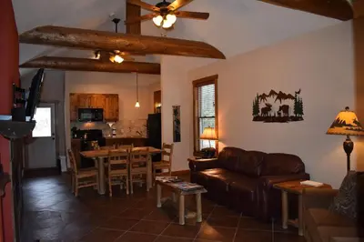 a living room with a couch and a table at Bears Den 1 - Hot Tub and Views! in Estes Park