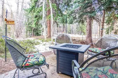 a grill with chairs and a table in a park at Cross Creek - Pool and Hot Tubs by Daniel in Frisco