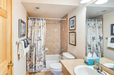a bathroom with a tub and a toilet and a sink at 6 Mi to Skiing Mtn-View Fraser Duplex in Fraser
