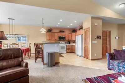 a kitchen and living room with a couch and a table at Lookout Ridge 45 by Great Western Lodging in Dillon