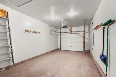 an empty room with a garage with a door at Lookout Ridge 45 by Great Western Lodging in Dillon