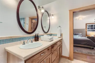 a bathroom with a sink and a mirror at Nederland Mountain Haven bungalow in Nederland