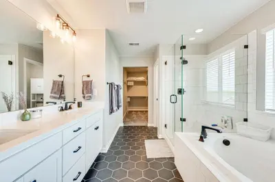 a bathroom with a tub and a sink and a shower at Berthoud Home with Fire Pit, Close to Lake Loveland! in Berthoud
