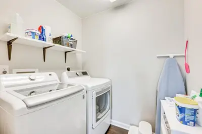 a laundry room with a washer and dryer at Berthoud Home with Fire Pit, Close to Lake Loveland! in Berthoud