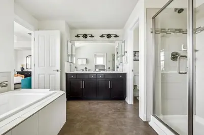 a bathroom with a tub and a sink and a shower at Modern Elegance - Pool Table - Walkable Area in Aurora