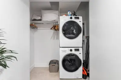 a laundry room with a washer and dryer in it at LuxuryDenver Studio w Hot Tub 2 Mi to Downtown in Denver