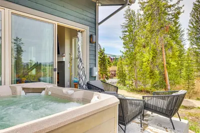 a hot tub on the patio of a house at Walk to Dtwn Fraser Retreat with Hot Tub and Views! in Winter Park