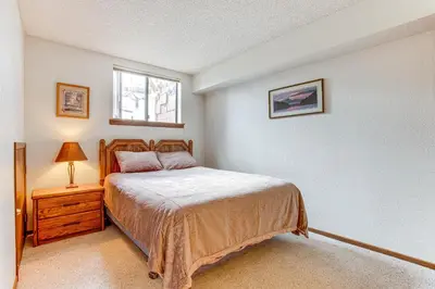 a small bedroom with a bed and a window at Fraser Mountain Retreat with Resort Amenities! in Fraser