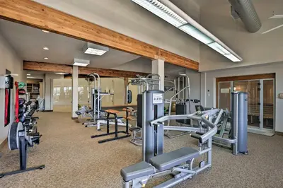 a gym with several treadmills and exercise bikes at Fraser Mountain Retreat with Resort Amenities! in Fraser