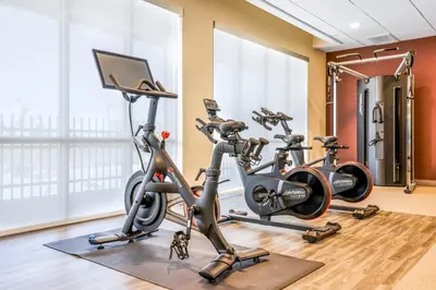 a gym with three exercise bikes in a room at Hampton Inn Aurora Medical Center Denver in Aurora