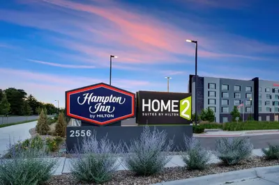 a sign for a hampton inn in front of a building at Hampton Inn Aurora Medical Center Denver in Aurora