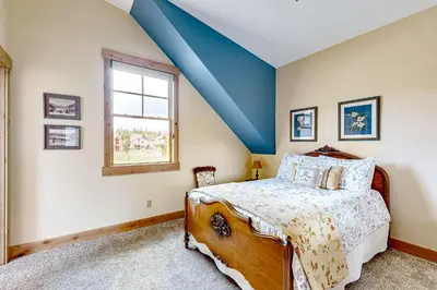 a bedroom with a bed and a window at Winter Park Ski & Summer Retreat in Fraser
