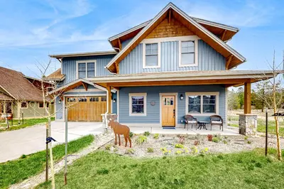 a blue house with a deer in front of it at Winter Park Ski & Summer Retreat in Fraser