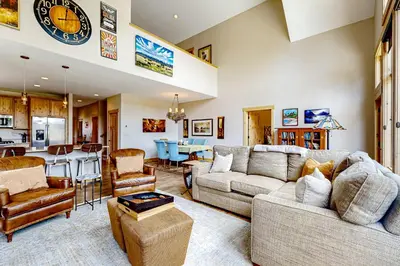 a living room with a couch and a table at Winter Park Ski & Summer Retreat in Fraser
