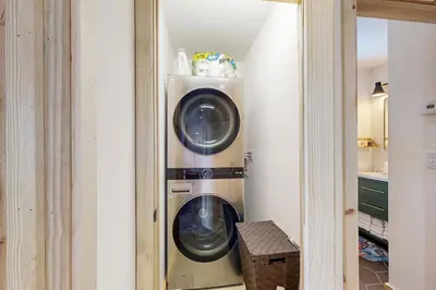 a washer and dryer in a small closet at Hytta Hyggelig in Tabernash
