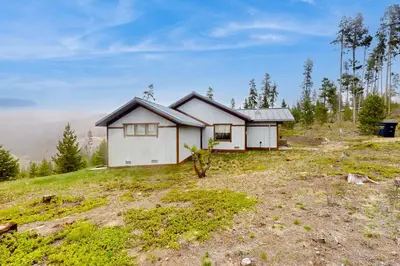 a white house on top of a hill at Mountain Minka in Grand Lake