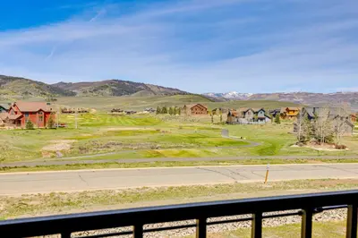 a view of a town with mountains in the background at Hot Tub and Mtn Views Townhome in Granby! in Granby