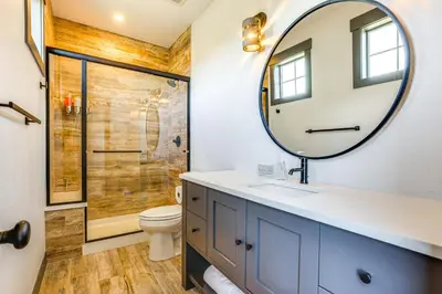 a bathroom with a sink and a mirror at Hot Tub and Mtn Views Townhome in Granby! in Granby