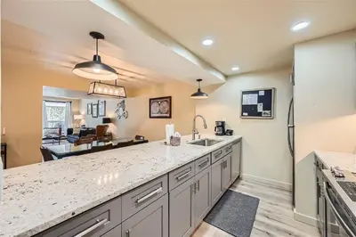 a kitchen with a sink and a counter top at 2509 Saints John condo in Keystone