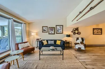 a living room with a couch and a table at 2509 Saints John condo in Keystone