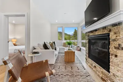 a living room with a fireplace and a couch at Clearwater Lofts 205 Building 3 in Keystone