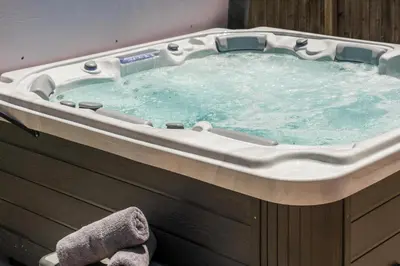 a hot tub with water in it in a room at NEW Modern, Luxury Home with Hot Tub, Gym, Sauna, and 12 Minutes to Denver in Arvada