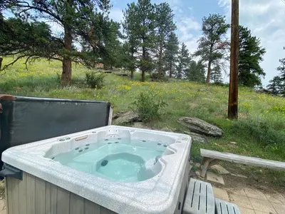 a jacuzziificialificialificialificialificialificialificialificialificialificialificial at Rose Den - Romantic Mountain Cabin with Views! in Estes Park
