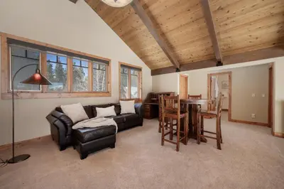 a living room with a couch and a table at Stagecoach Cabin home in Fraser