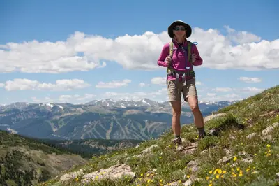 a woman standing on top of a mountain at Base Camp 313 condo in Granby