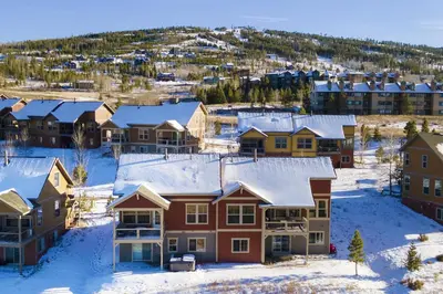 a suburb covered in snow with houses at Peak View Drive townhouse in Granby