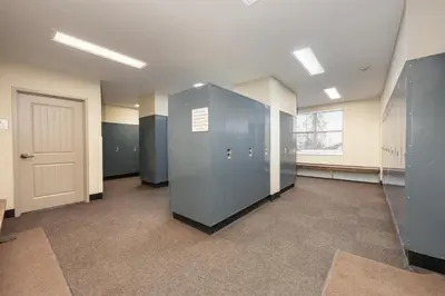 a hallway with a row of lockers and a door at Base Camp 306 condo in Granby