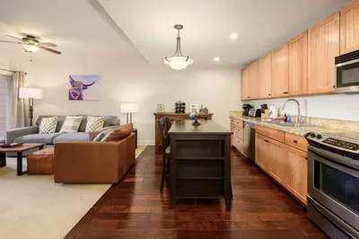 a kitchen and a living room with a couch at Base Camp 304 condo in Granby