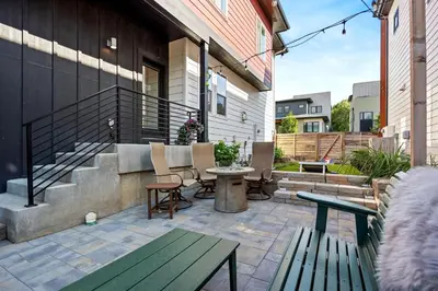a patio with benches and a table and stairs at Upbeat Retreat - Enjoy Bikes, Brews and Mtn Peaks! in Fort Collins