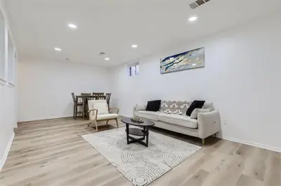 a living room with a couch and a table at 15-mins from DIA, Fenced-Yard, Garage, Remodeled in Aurora