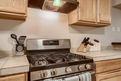a kitchen with a stove top oven in a kitchen at 1000 Dollar Rebate if You Buy A Home in Denver in Lakewood
