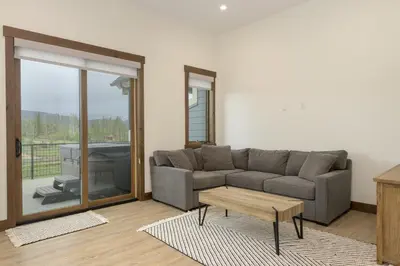 a living room with a couch and a table at 90 Hay Meadow townhouse in Fraser