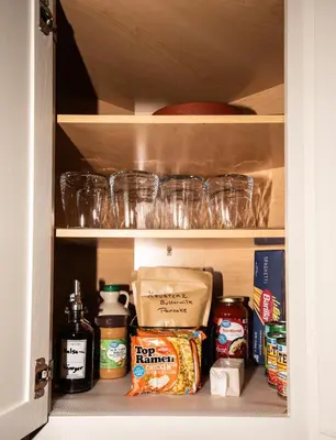 a cupboard filled with food and other food items at InHomeStays in Lakewood