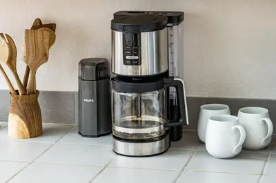 a coffee maker sitting on a counter next to cups at Mountain View Apartment Near Downtown & Trails in Evergreen