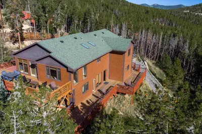 an aerial view of a house with a roof at Mountain View Apartment Near Downtown & Hiking in Evergreen