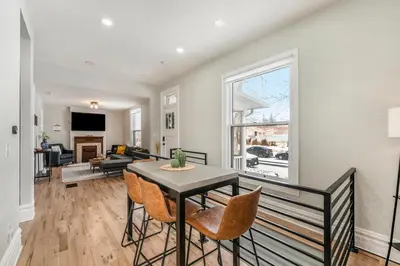 a living room with a table and chairs at Outdoor Living and comfort by RiNo BBQ Office in Denver