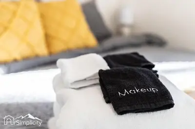 two towels sitting on top of a bed at Sunnyside guesthouse near Rocky Mountain Lake in Denver