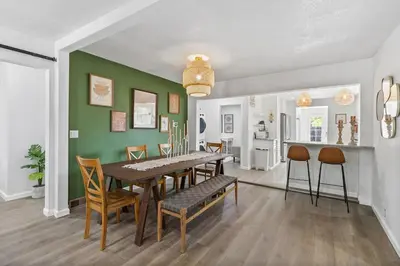 a dining room with a table and chairs at Modern Family Home Rooftop Patio Game Room in Denver