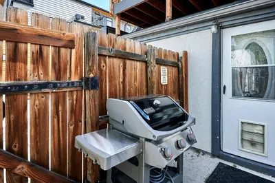 a sewing machine sitting in front of a fence at Work-Friendly Denver Stay - Rooftop Deck & Garden in Denver