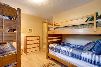 a bedroom with two bunk beds at Riverside Condo in Downtown Winter Park! in Winter Park